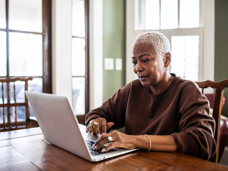 Senior-woman-using-laptop-at-home